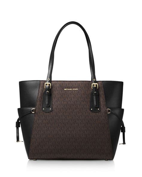 michael kors voyager east west signature tote black|signature voyager east west tote.